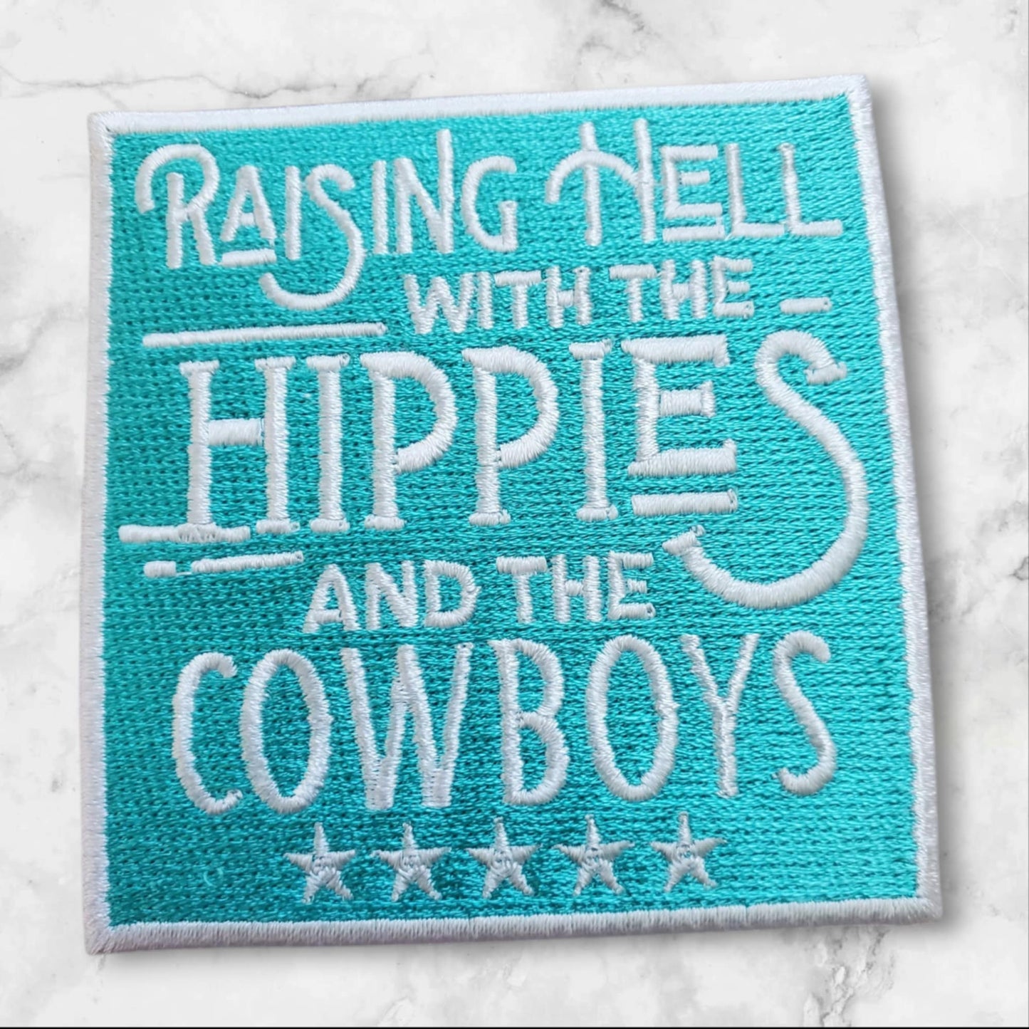 Raising Hell with the Hippies and the Cowboys – Embroidered Patch (Turquoise + White)