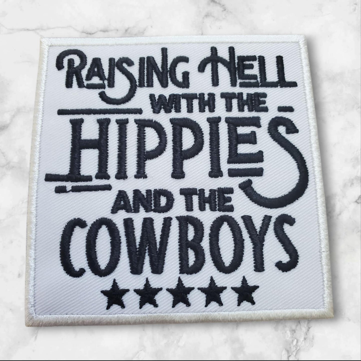 Raising Hell with the Hippies and the Cowboys – Embroidered Patch (White + Black)
