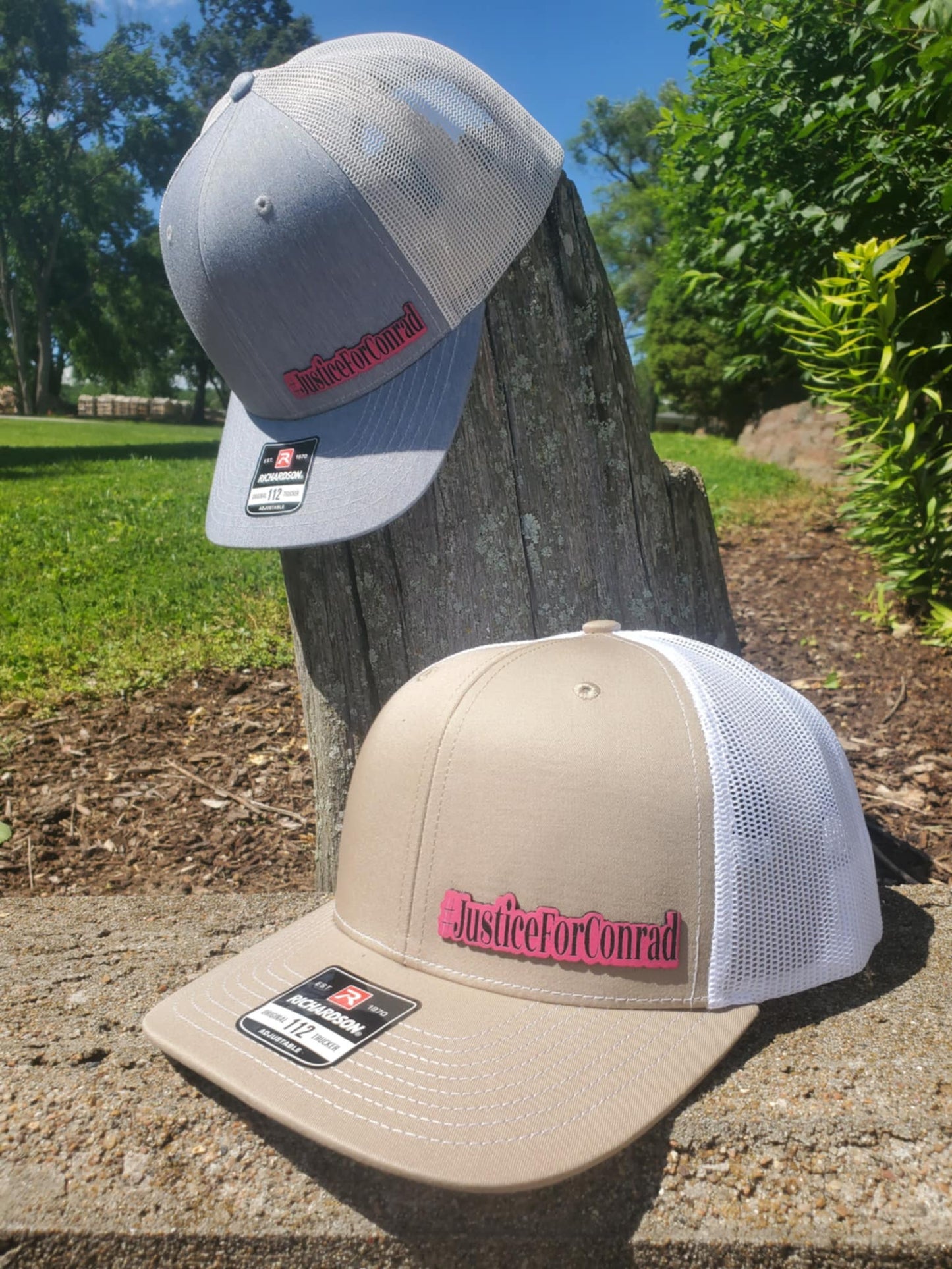 This Richardson 112 Khaki and White trucker hat features a premium HOT PINK leatherette patch honoring the memory of Conrad Ashcraft