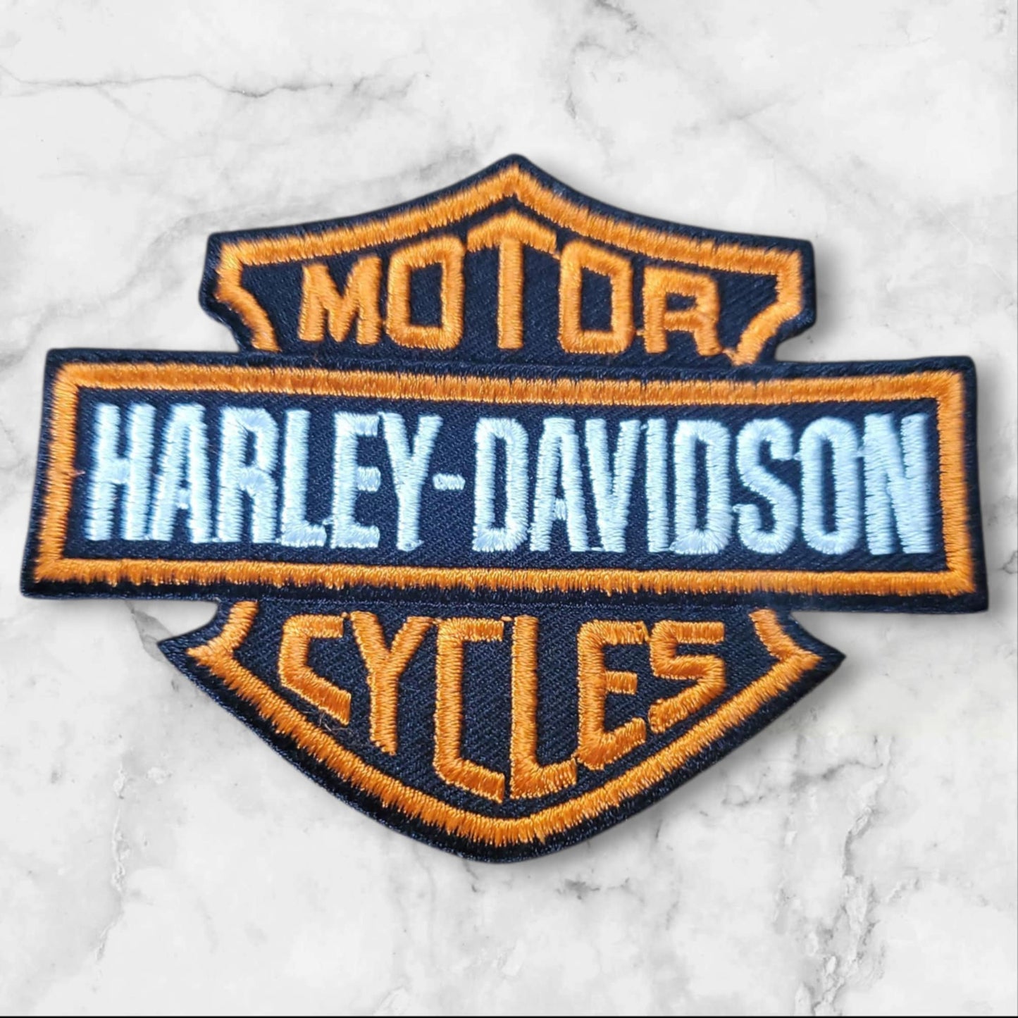 Orange & Black Embroidered Shield Patch – Bold Stripe Design