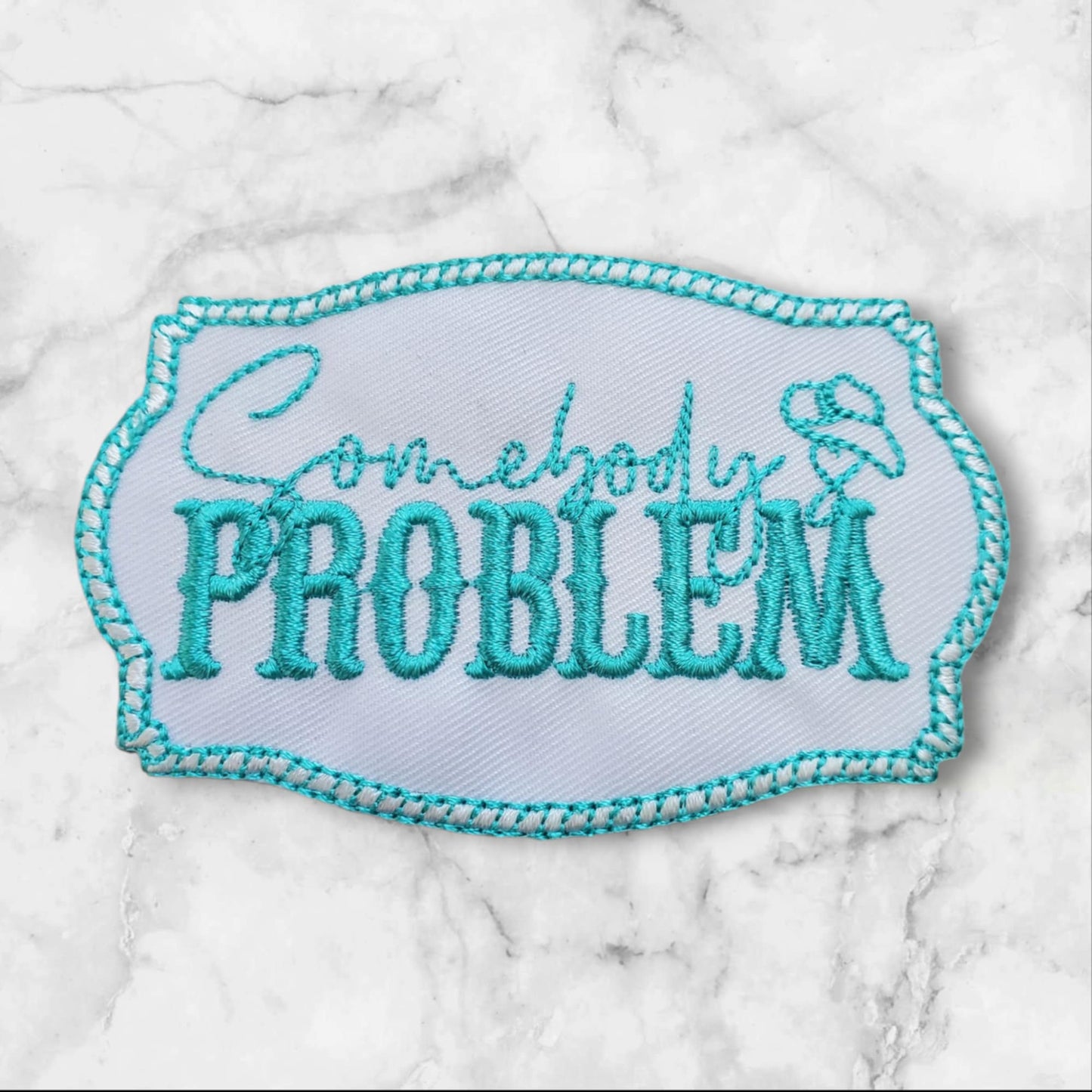Somebody’s Problem – Embroidered Patch (White + Turquoise)