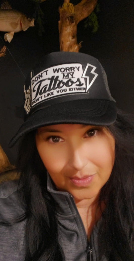 Black-on-Black Trucker Hat with "Don’t Worry, My Tattoos Don’t Like You Either" Patch