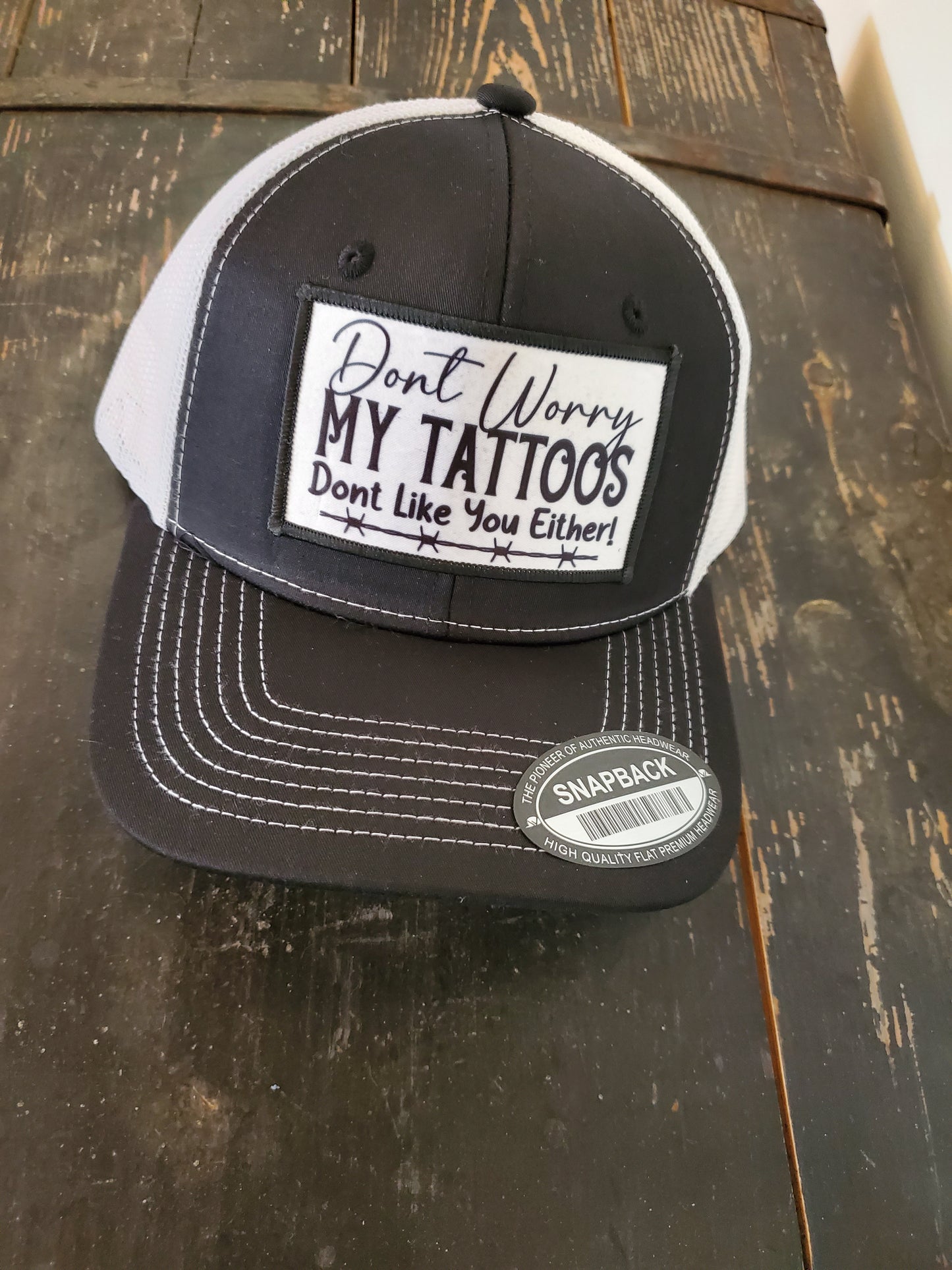 Black and White Snapback Hat with Custom "Don't Worry, My Tattoos Don't Like You Either" Patch